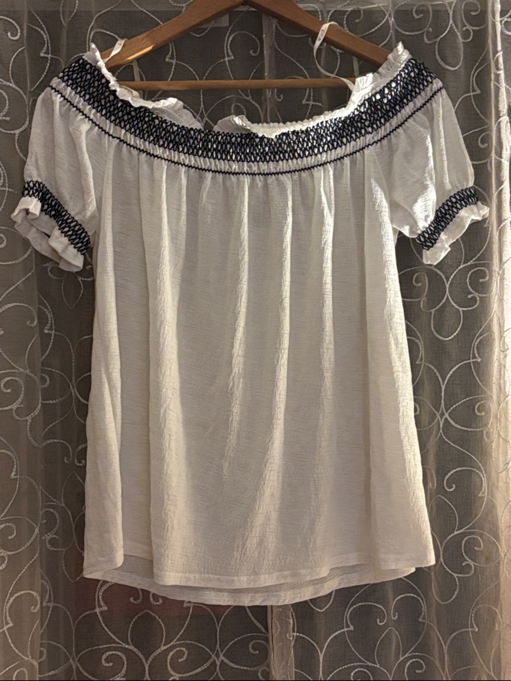 Off-Shoulder White Peasant Top with Navy Smocked Trim